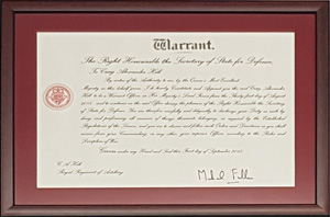 Framed with a dark red mount